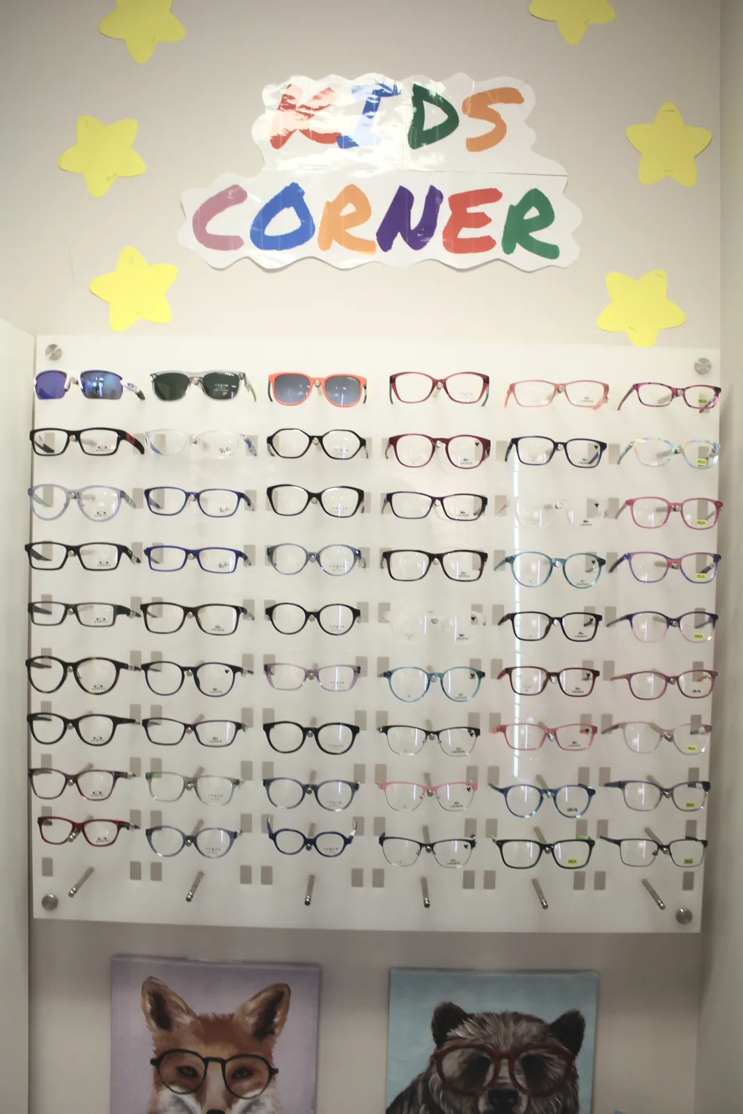 Children’s eyeglass frames displayed in the Smithfield optical kids’ corner.